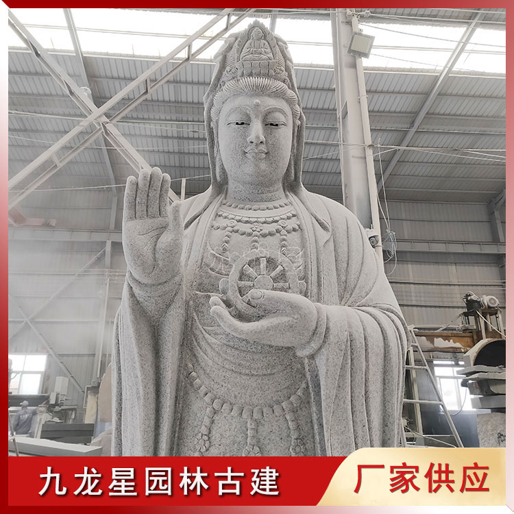 1654740991142363.jpg 石雕觀音像手托法輪圖片/